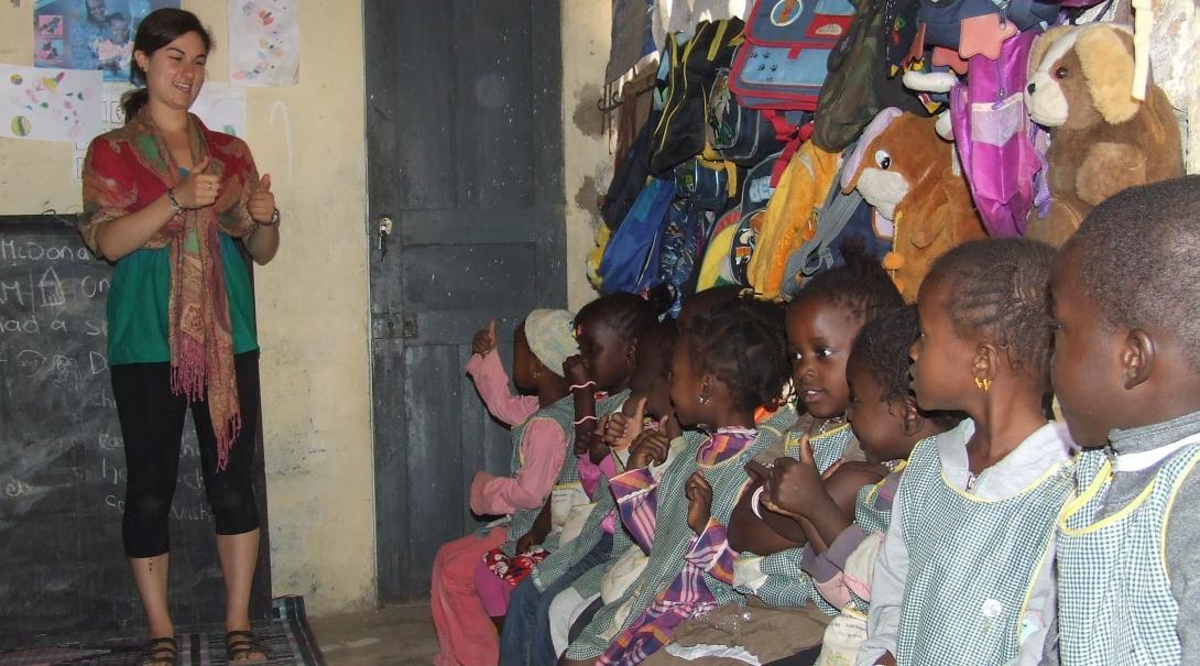 A Projects Abroad volunteer gives a lesson at a kindergarten for her volunteer work with children in Senegal. A volunteer with children in Senegal gives a lesson at a kindergarten.